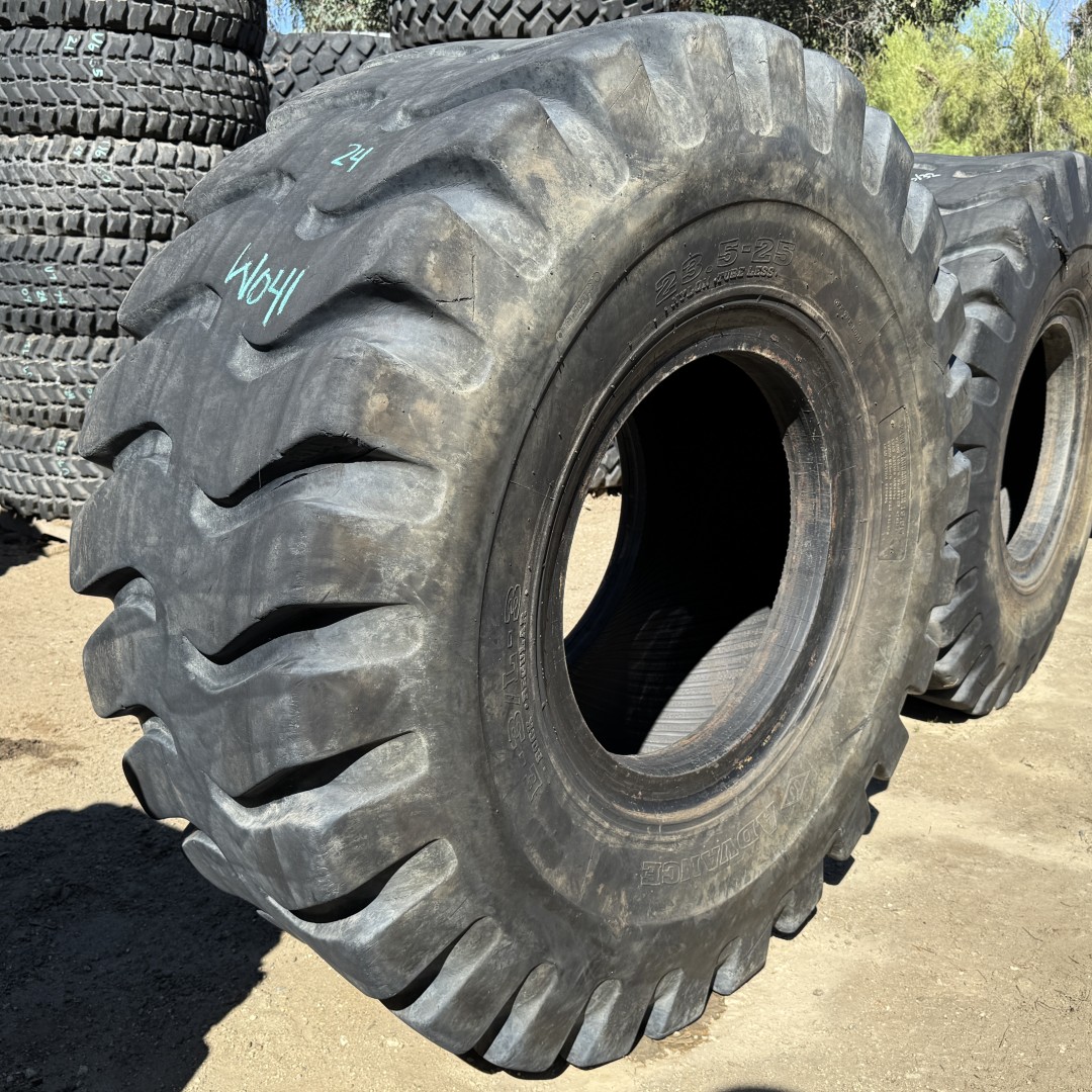 <font color='#da2127' font size ='2'><b>23.5X25 Advance OTR Tire E-3 L-3 Rock Regular 24-Ply </font></b><br><font size ='1' color='grey'>CONDITION: </font><font size ='2'>Used<br><font size ='1' color='grey'>TREAD DEPTH:</font><font size ='2'> 24/32nds<br><font size ='1' color='grey'>DETAILS:</font><font size ='2'> Clean, Old<br><font size ='1' color='grey'>REF #:</font><font size ='2'> W041<br><font size ='1' color='grey'>LOCATION:</font><font size ='2'> San Jacinto, CA