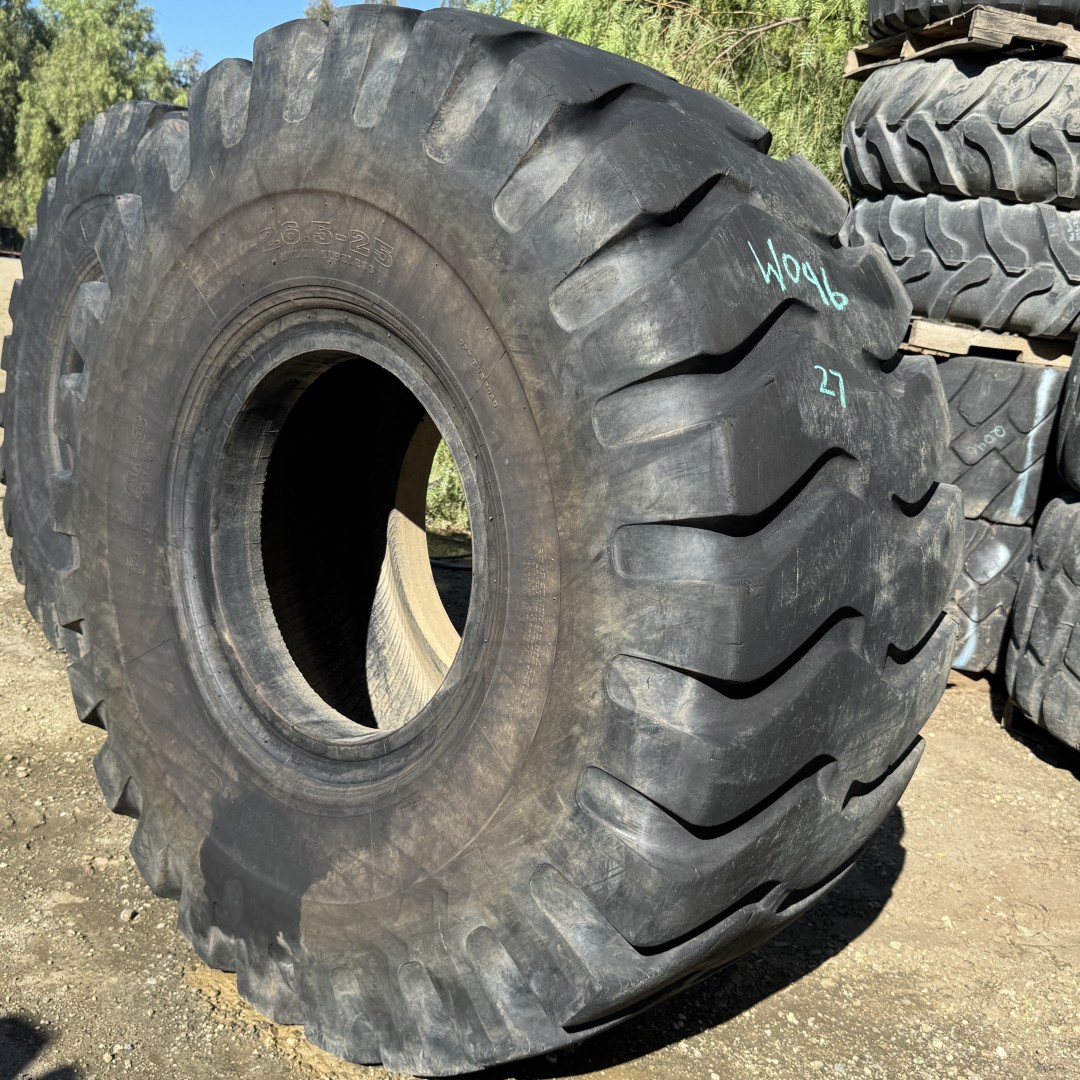 <font color='#da2127' font size ='2'><b>26.5X25 Advance OTR Tire E-3 L-3 Rock Regular 20-Ply </font></b><br><font size ='1' color='grey'>CONDITION: </font><font size ='2'>Used<br><font size ='1' color='grey'>TREAD DEPTH:</font><font size ='2'> 27/32nds<br><font size ='1' color='grey'>DETAILS:</font><font size ='2'> Clean, Mildly Aged Tread<br><font size ='1' color='grey'>REF #:</font><font size ='2'> W046<br><font size ='1' color='grey'>LOCATION:</font><font size ='2'> San Jacinto, CA