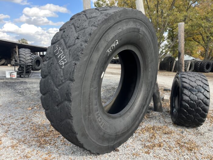 <font color='#da2127' font size ='2'><b>27.00R49 Michelin OTR Tire E-4 XDR 2-Star </font></b><br><font size ='1' color='grey'>CONDITION: </font><font size ='2'>Retread-Used<br><font size ='1' color='grey'>TREAD DEPTH:</font><font size ='2'>  25/32nds<br><font size ='1' color='grey'>DETAILS:</font><font size ='2'> Clean, Small Sidewall Spot<br><font size ='1' color='grey'>REF #:</font><font size ='2'> G33742<br><font size ='1' color='grey'>LOCATION:</font><font size ='2'> St. Louis, MO