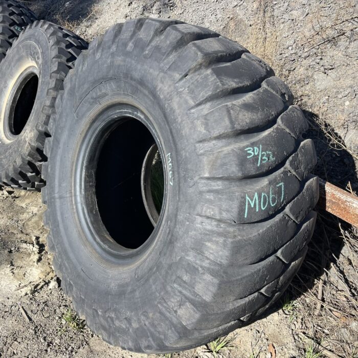 <font color='#da2127' font size ='2'><b>23.5X25 Titan OTR Tire E-3 L-3 NDLCM 20-Ply </font></b><br><font size ='1' color='grey'>CONDITION: </font><font size ='2'>Used<br><font size ='1' color='grey'>TREAD DEPTH:</font><font size ='2'>  30/32nds<br><font size ='1' color='grey'>DETAILS:</font><font size ='2'> Clean, Rough Tread<br><font size ='1' color='grey'>REF #:</font><font size ='2'> M067<br><font size ='1' color='grey'>LOCATION:</font><font size ='2'> Echo, OR