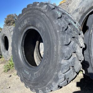 <font color='#da2127' font size ='2'><b>20.5R25 Michelin OTR Tire E-3 L-3 XHA2 1-Star </font></b><br><font size ='1' color='grey'>CONDITION: </font><font size ='2'>Used<br><font size ='1' color='grey'>TREAD DEPTH:</font><font size ='2'>  33/32nds<br><font size ='1' color='grey'>DETAILS:</font><font size ='2'> Clean, 1-Nail Patch, Weathered Tread<br><font size ='1' color='grey'>REF #:</font><font size ='2'> M018<br><font size ='1' color='grey'>LOCATION:</font><font size ='2'> Fowler, CA