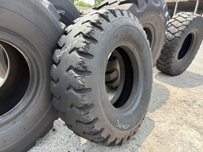 <font color='#da2127' font size ='2'><b>18.00X33 Constellation OTR Tire E-3 Rock Mine Lug 32-Ply </font></b><br><font size ='1' color='grey'>CONDITION: </font><font size ='2'>Used<br><font size ='1' color='grey'>TREAD DEPTH:</font><font size ='2'>  24/32nds<br><font size ='1' color='grey'>DETAILS:</font><font size ='2'> Clean, Sidewall Spot<br><font size ='1' color='grey'>REF #:</font><font size ='2'> G36407<br><font size ='1' color='grey'>LOCATION:</font><font size ='2'> St. Louis, MO
