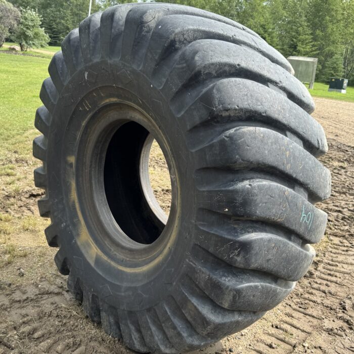 <font color='#da2127' font size ='2'><b>26.5X25 Goodyear OTR Tire E-3 L-3 SHRL Super Hard Rock Lug 20-Ply </font></b><br><font size ='1' color='grey'>CONDITION: </font><font size ='2'>Used<br><font size ='1' color='grey'>TREAD DEPTH:</font><font size ='2'>  40/32nds<br><font size ='1' color='grey'>DETAILS:</font><font size ='2'> 1-Tread Section & Spot<br><font size ='1' color='grey'>REF #:</font><font size ='2'> SK104<br><font size ='1' color='grey'>LOCATION:</font><font size ='2'> Saskatoon, SK