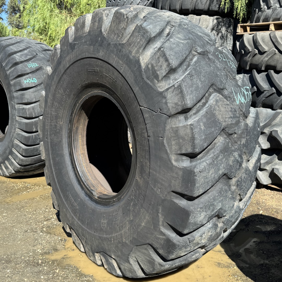 <font color='#da2127' font size ='2'><b>29.5X29 Firestone OTR Tire E-3 L-3 SRG Super Rock Grip 28-Ply </font></b><br><font size ='1' color='grey'>CONDITION: </font><font size ='2'>Used<br><font size ='1' color='grey'>TREAD DEPTH:</font><font size ='2'> 32/32nds<br><font size ='1' color='grey'>DETAILS:</font><font size ='2'> Clean, Weathered Tread, Cosmetic Sidewall Cuts<br><font size ='1' color='grey'>REF #:</font><font size ='2'> W057<br><font size ='1' color='grey'>LOCATION:</font><font size ='2'> San Jacinto, CA